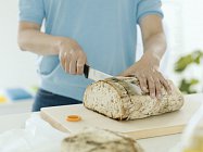 Fiskars_Action_Functional Form_Bread knife with sheath_cutting bread (1)